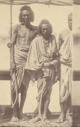 Portrait of Three Native Men Standing on a Boat